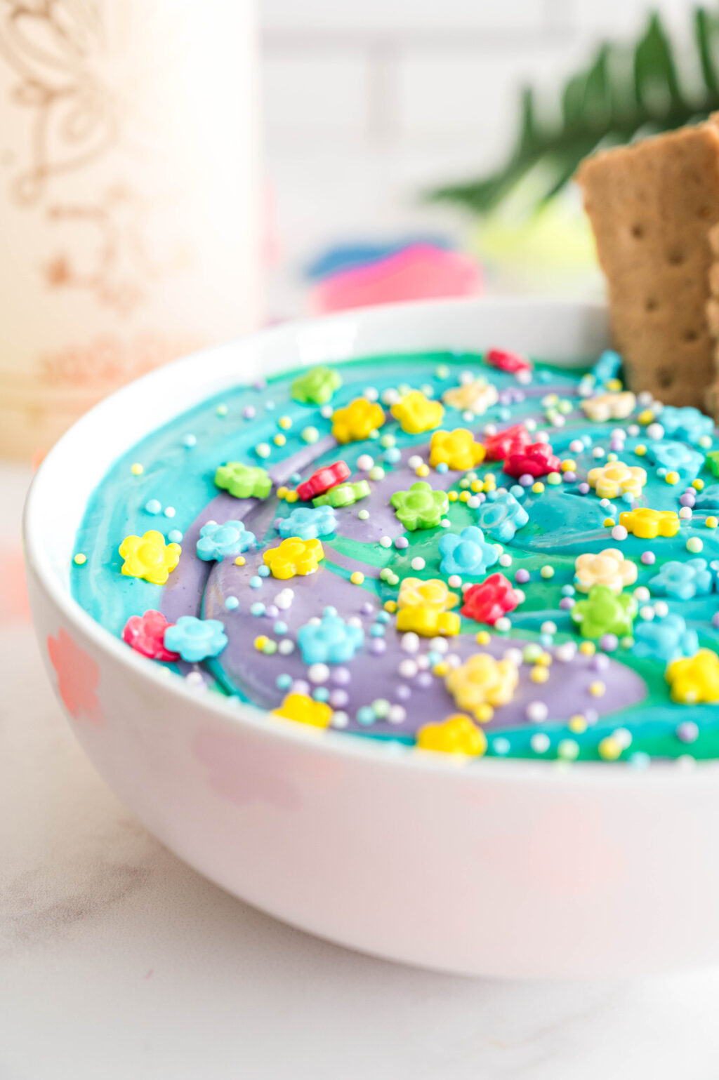 colorful encanto dip in a white bowl