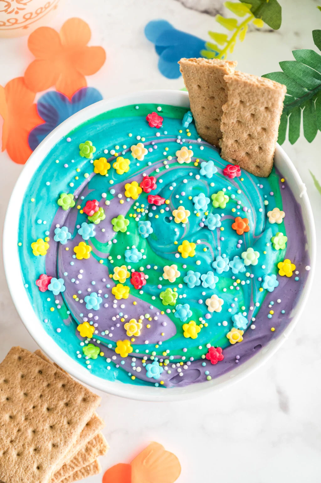 colorful encanto dip in a white bowl on a table