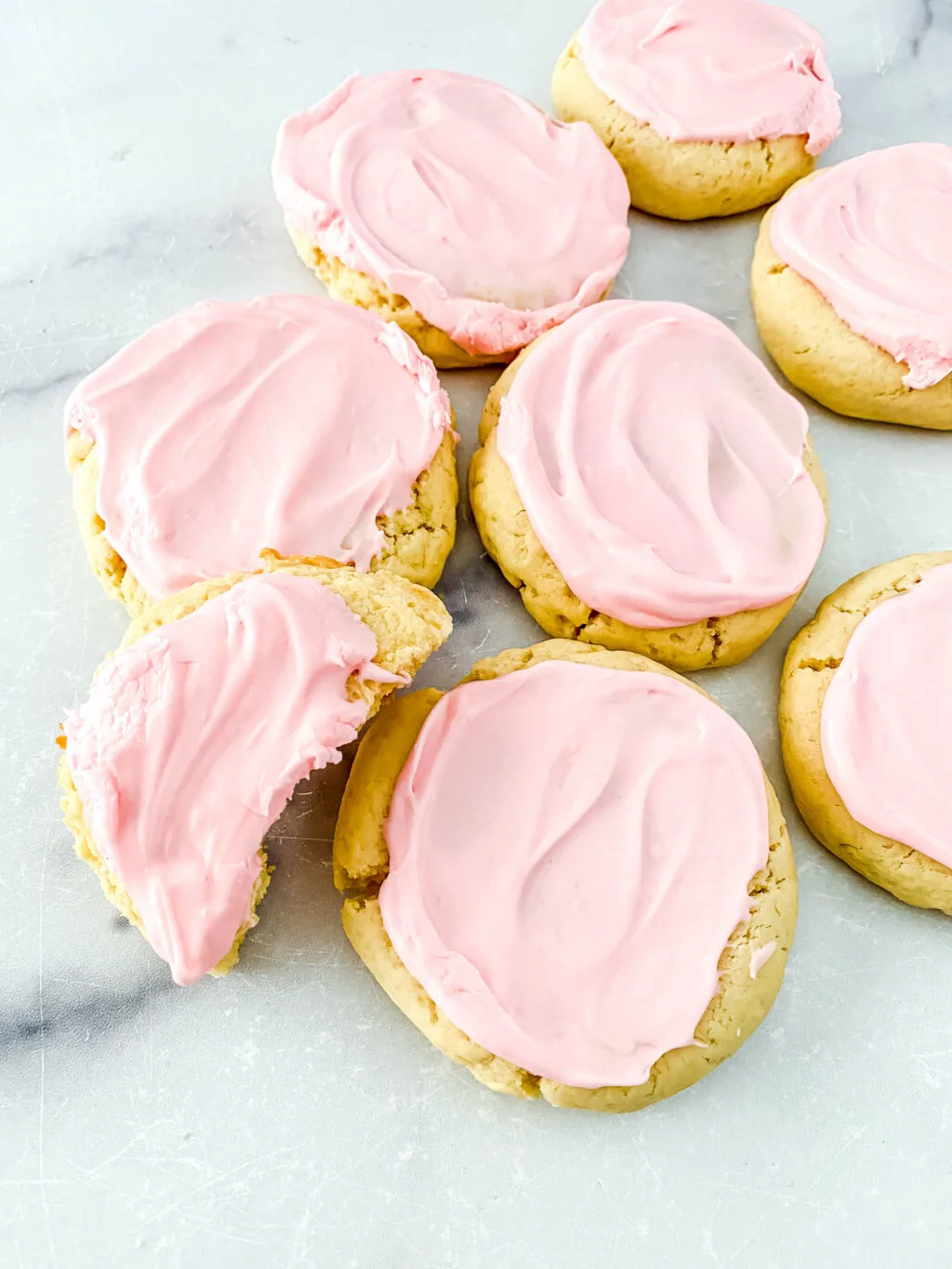 copycat crumbl sugar cookies on a white marble table