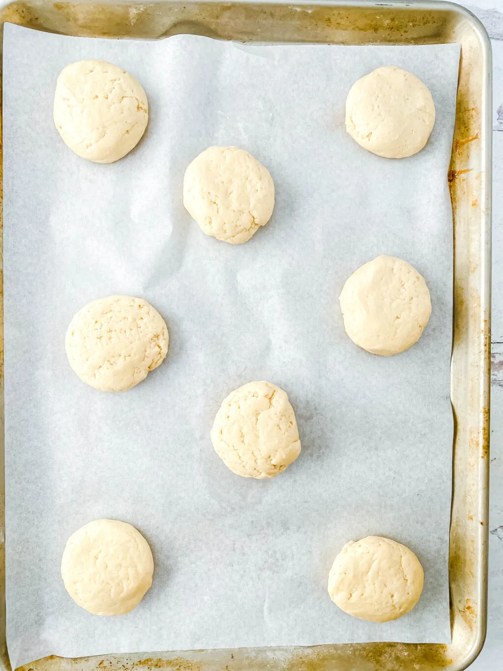 sugar cookie dough balls on cookie sheet