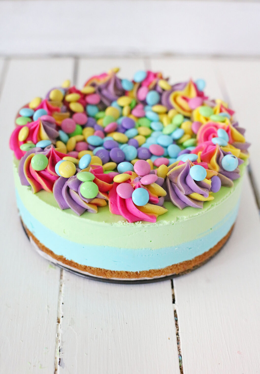 fully decorated 9 inch easter cheesecake on serving plate