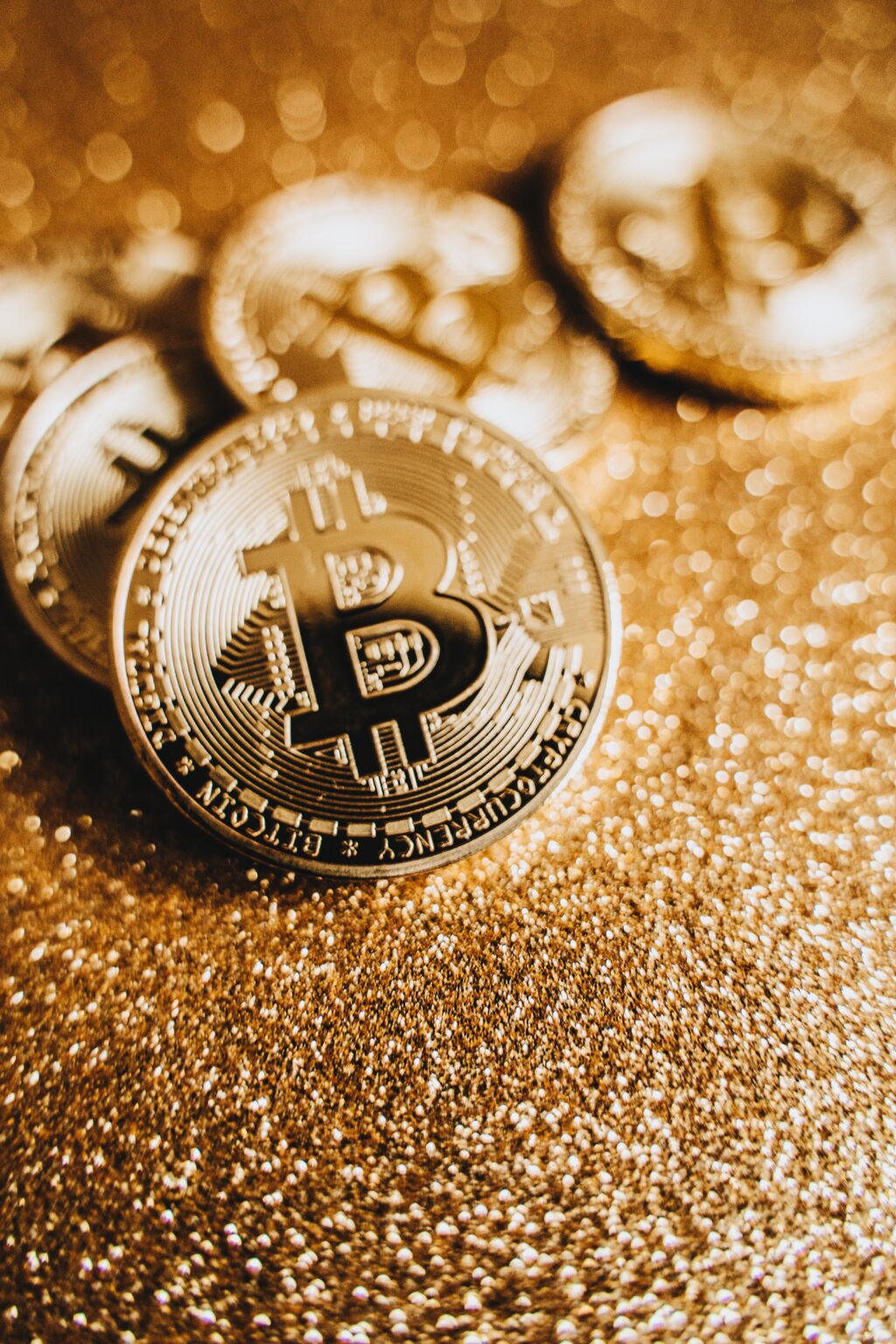 bitcoins on glittered paper