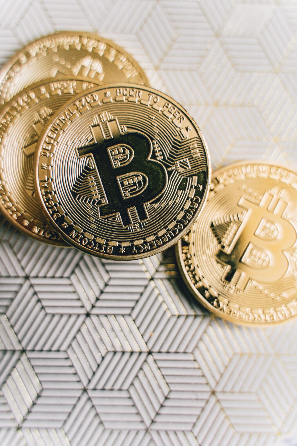 bitcoins on white and gold paper
