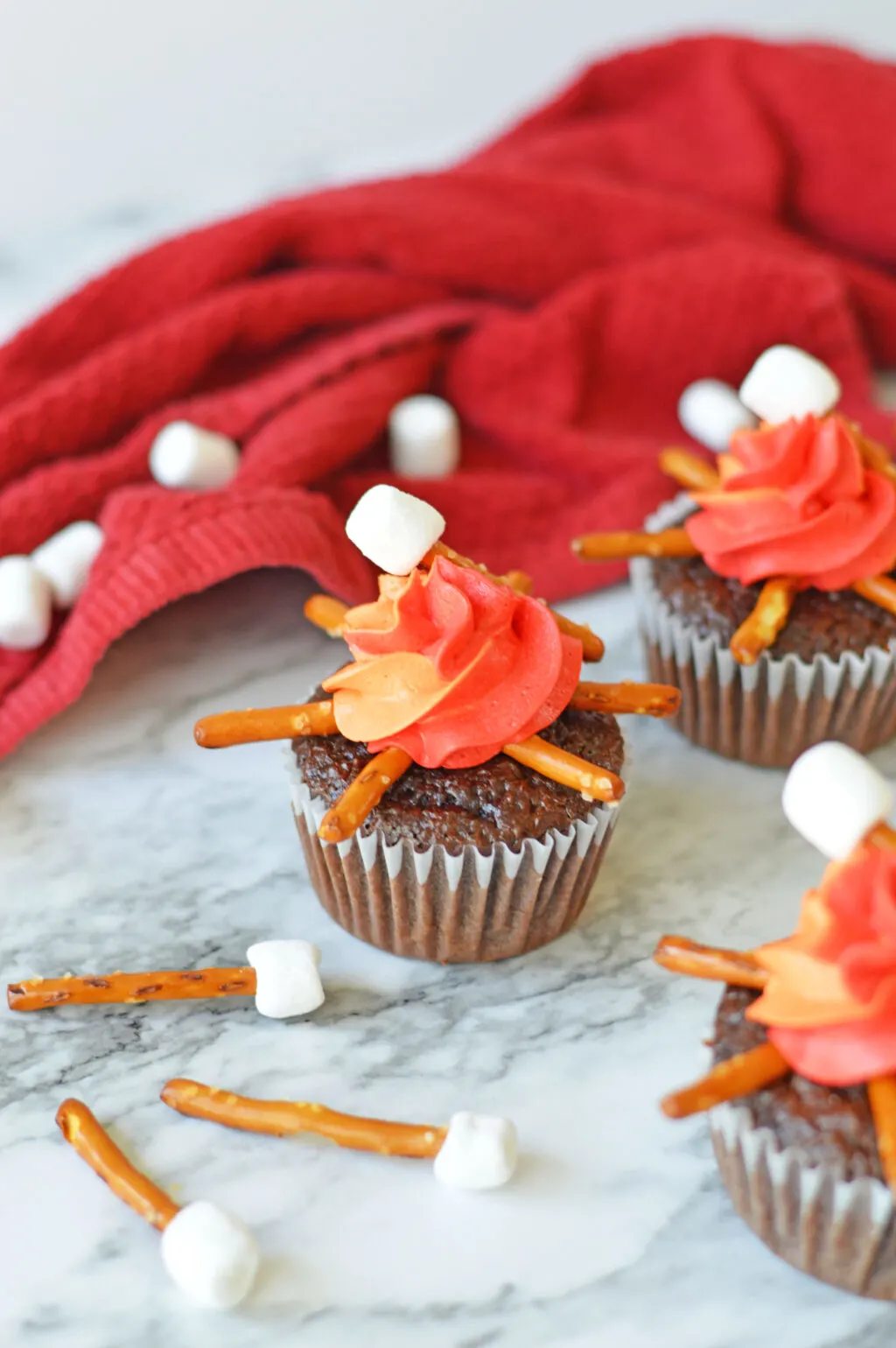 campfire cupcakes on a white marble table