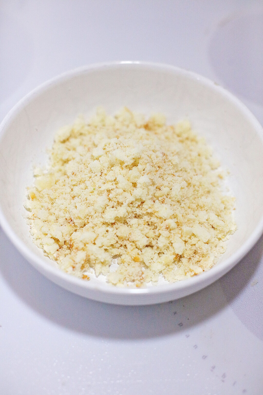 white cake mix crumbles in large white bowl