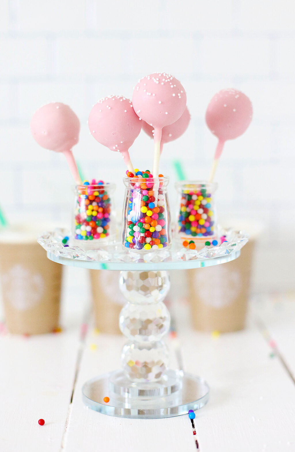 Copycat Starbucks Birthday Cake Pops in a glass jar filled with rainbow sprinkles