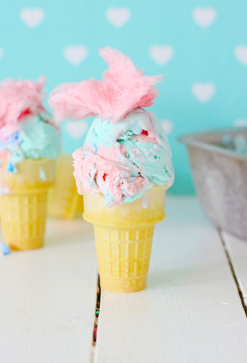 homemade cotton candy ice cream in a waffle cone