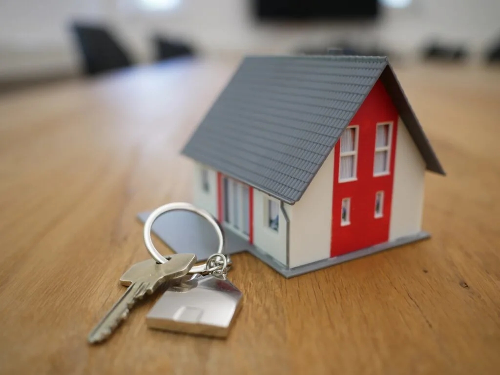 mini house with keys next to it