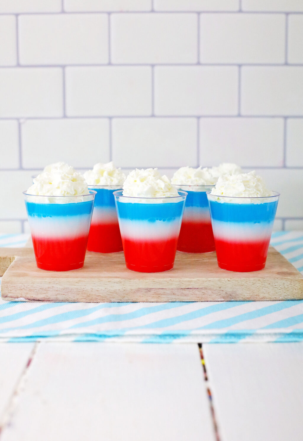 4th of july jello shots on a wood cutting board