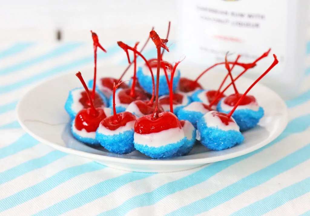 boozy cherry bombs on a round white plate