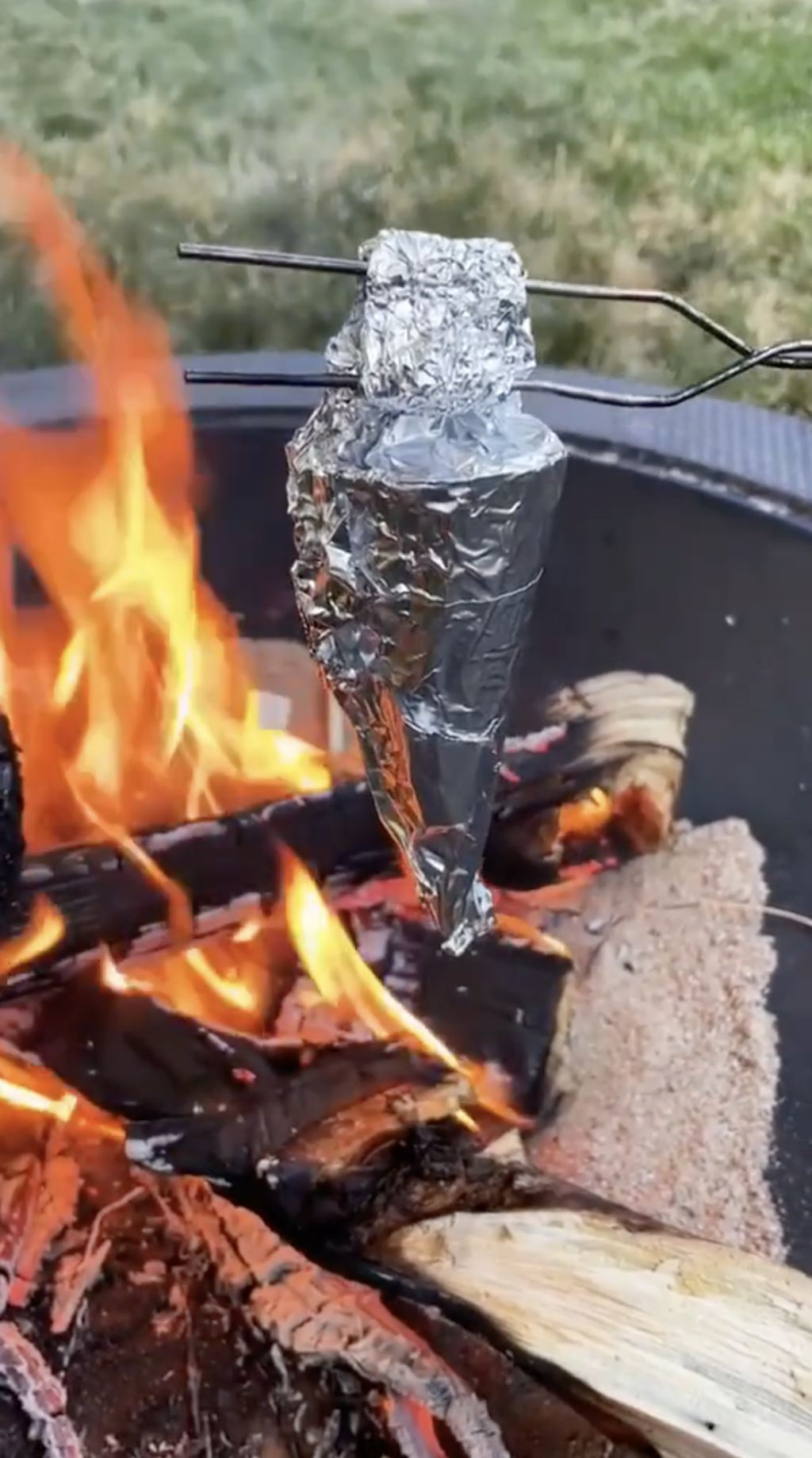 campfire cone cooking over a campfire