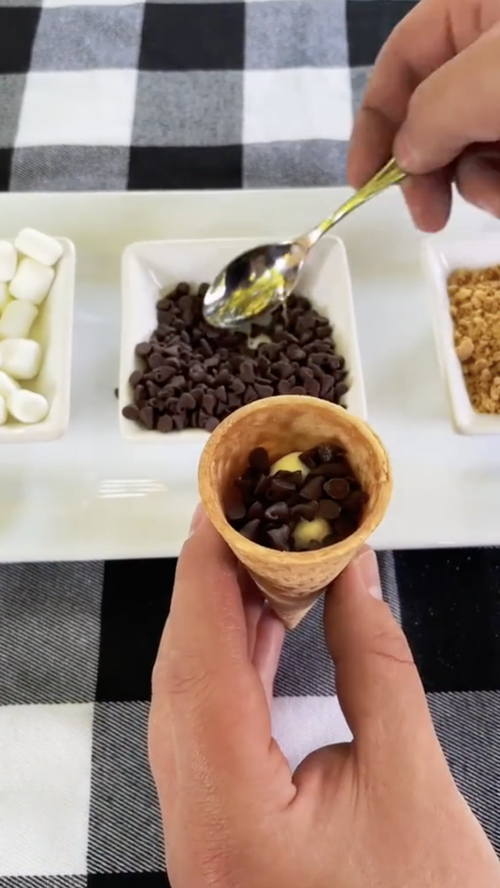 mini marshmallows and mini chocolate chips inside a sugar cone