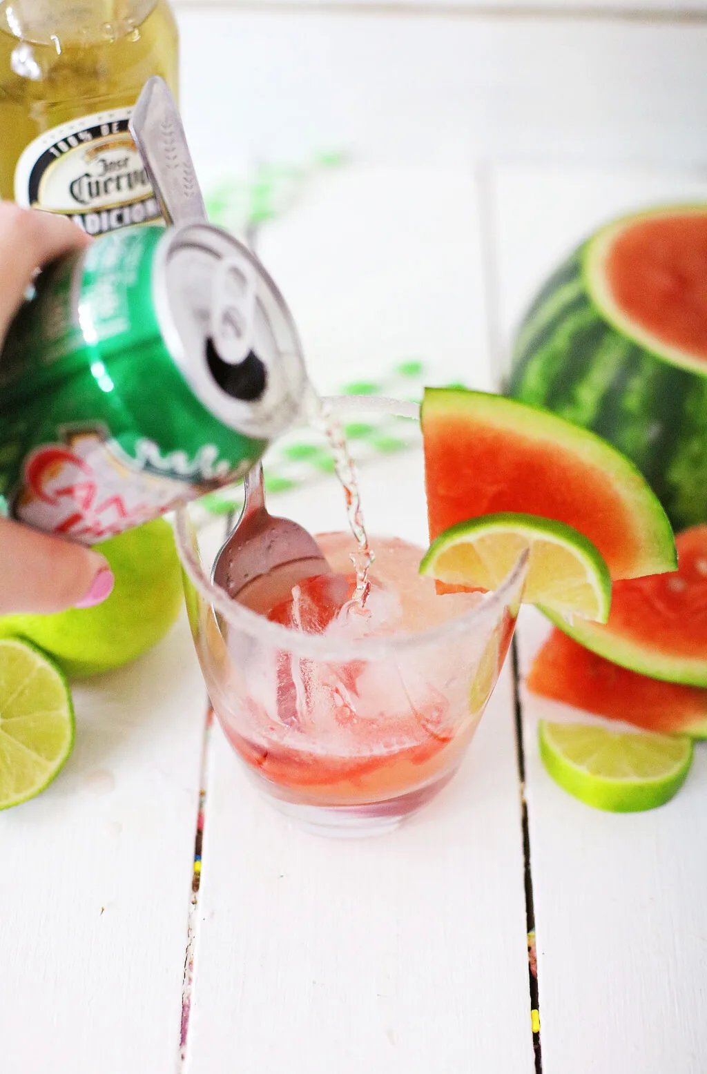 ginger ale being poured into watermelon margarita glass