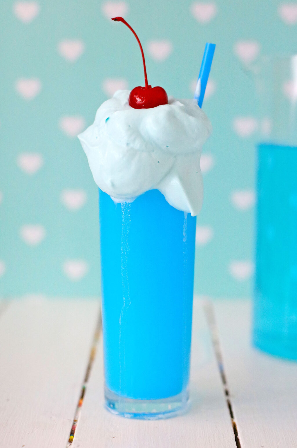 side view of whipped kool-aid inside a blue drink