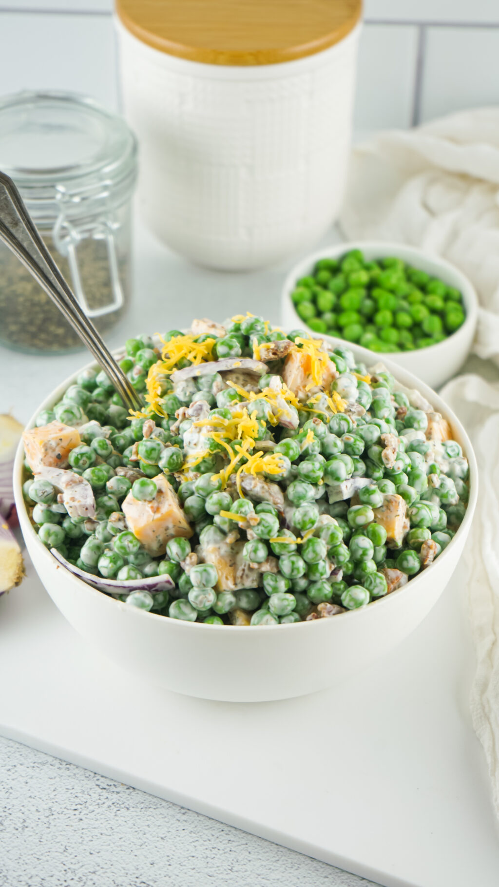 classic bacon pea salad in a white bowl