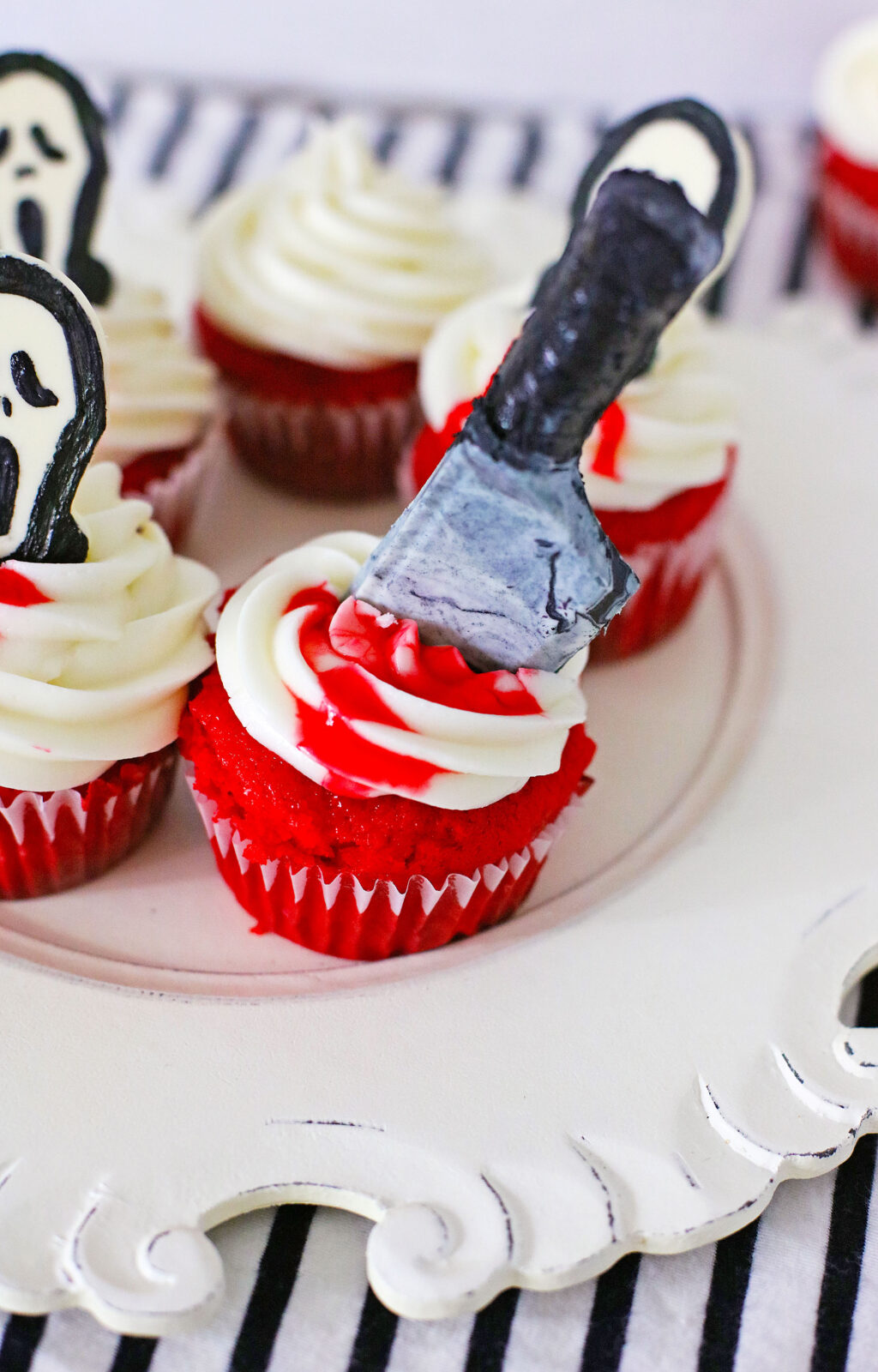 scream cupcakes with large edible knife topper on top