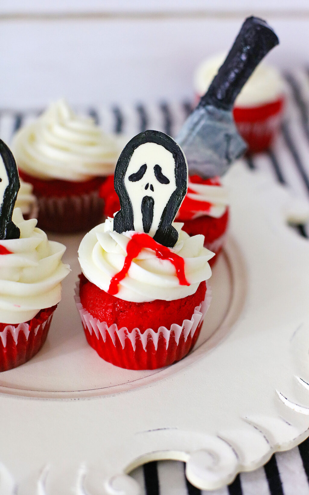 scream cupcakes on a white wood table