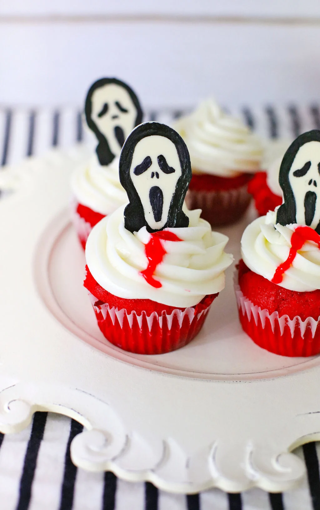 upclose of scream cupcakes on a serving tray for Halloween