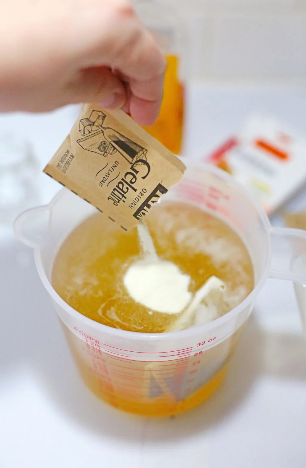 gelatin mix being poured in tea