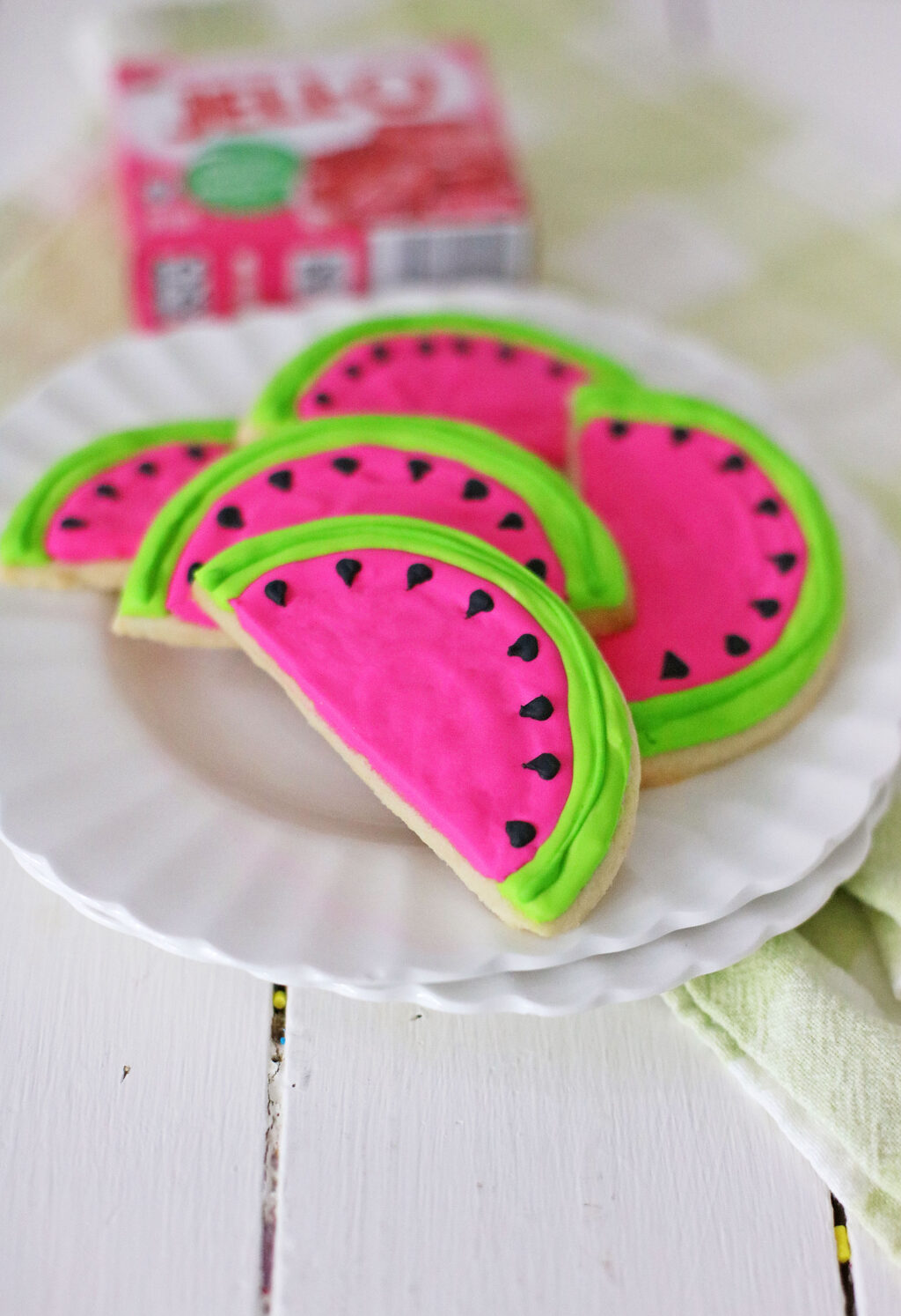 stacked watermelon cookies on a white plate