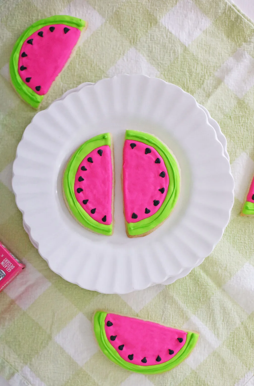 sliced watermelon cookies on a white round plate
