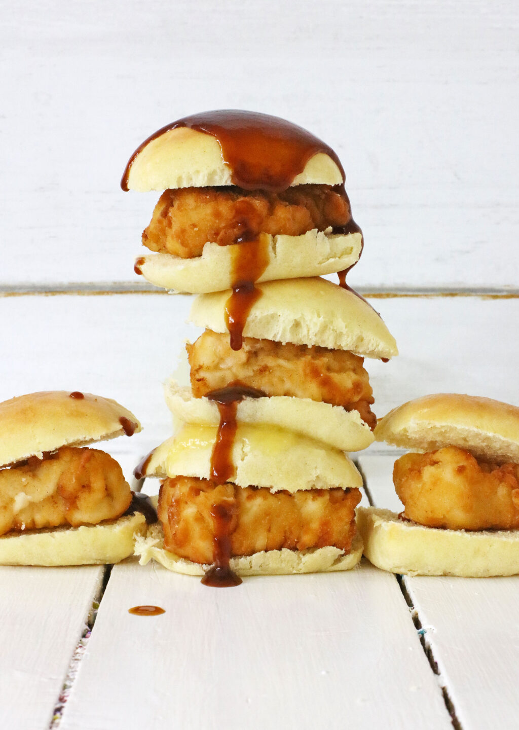 Copycat Chick-Fil-A Chicken Minis stacked with barbecue sauce on them