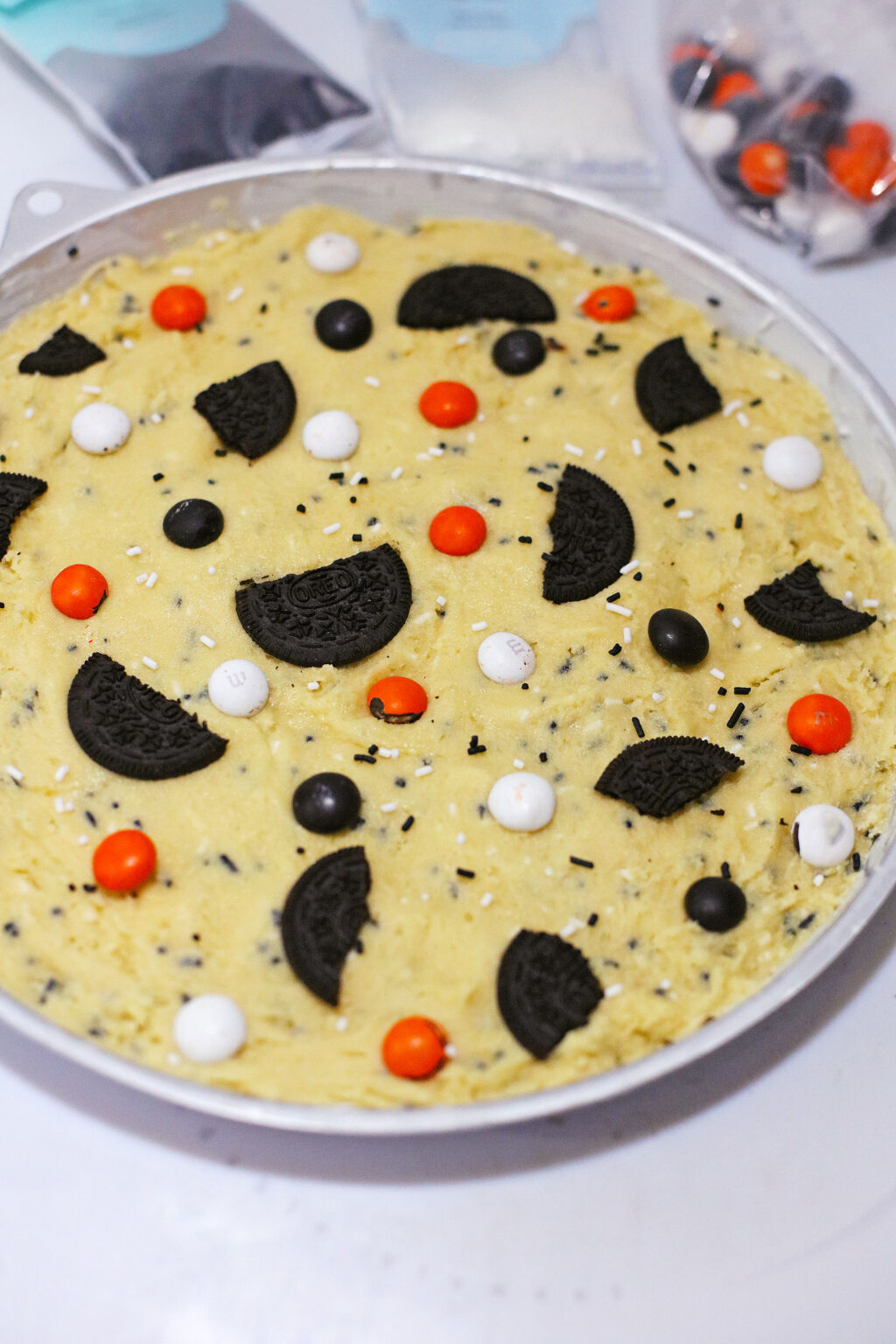 halloween cookie dough in large cookie pan ready to bake