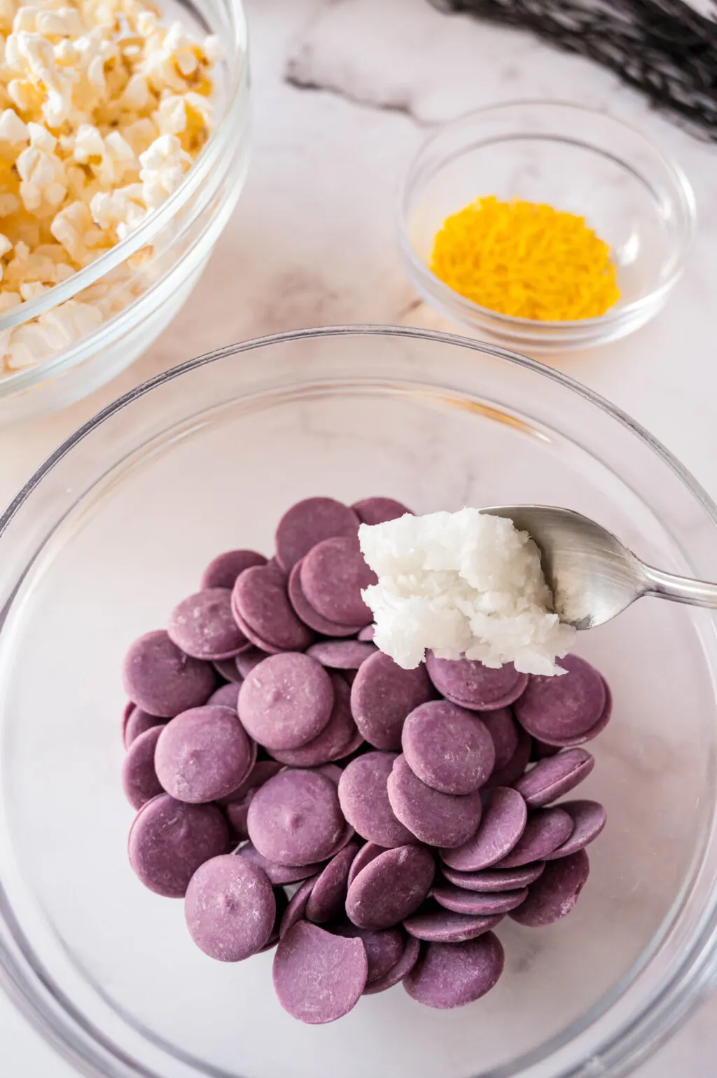 coconut oil being added to purple candy melts