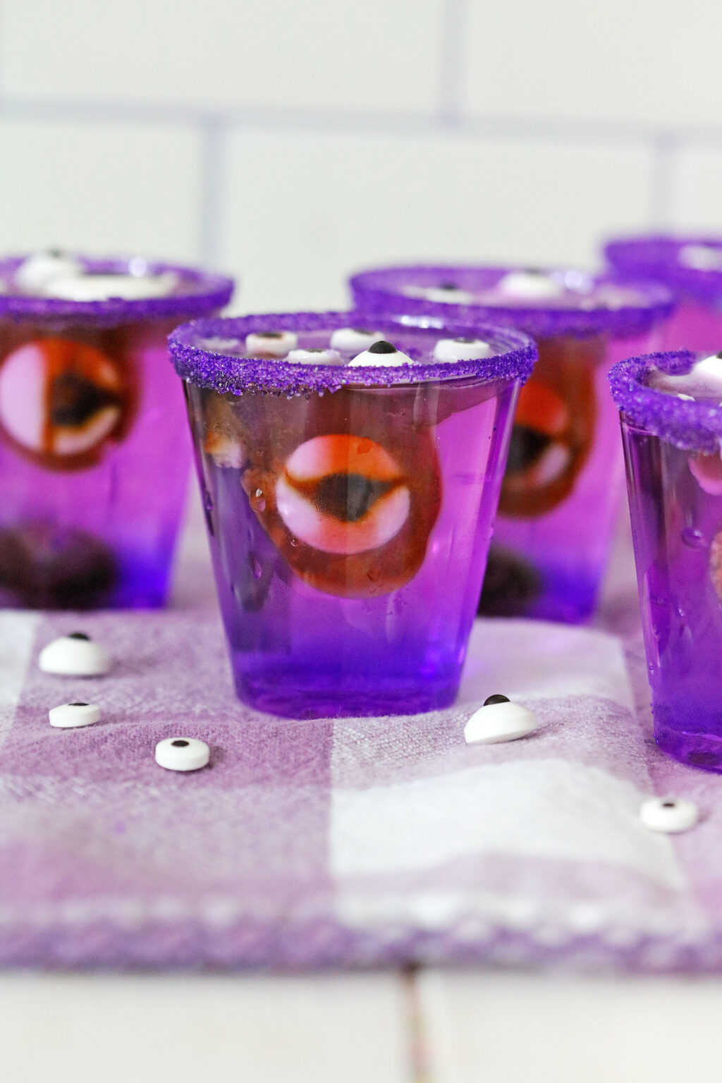 monster eye jello shots on top of purple napkin