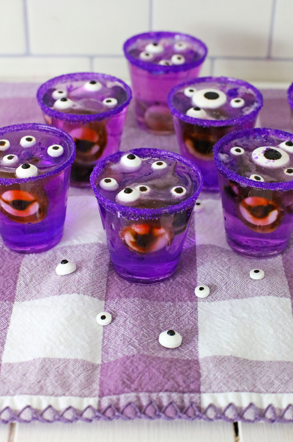monster eye jello shots on purple plaid napkin