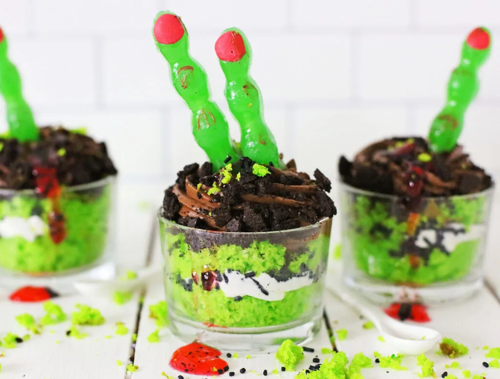 zombie finger cakes on white wood table