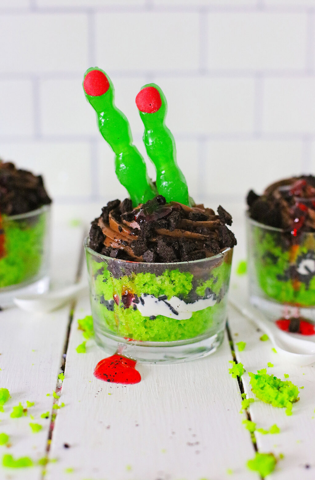 zombie finger cakes in bowl on white wood table