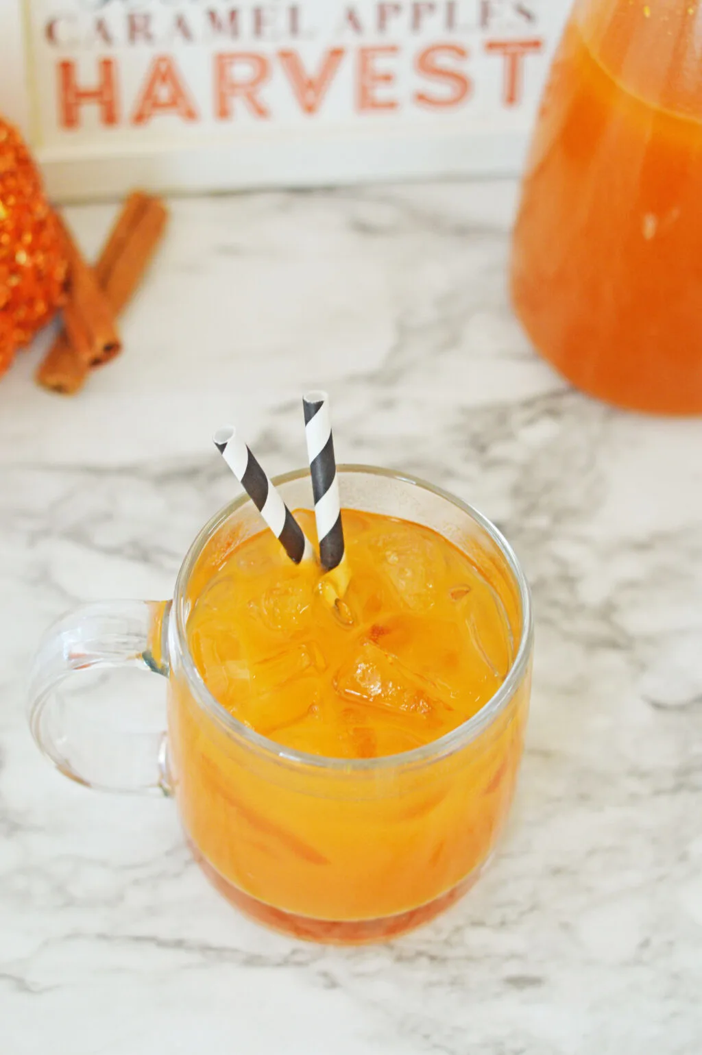 pumpkin juice in glass with straws