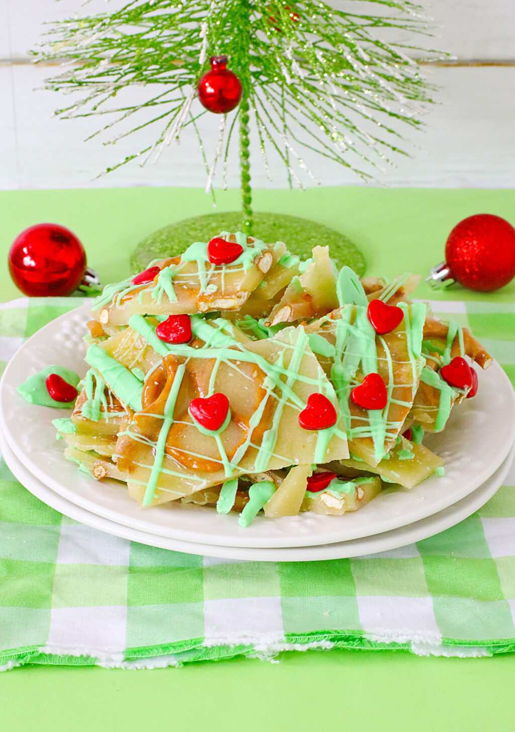 grinch brittle pieces on a white plate