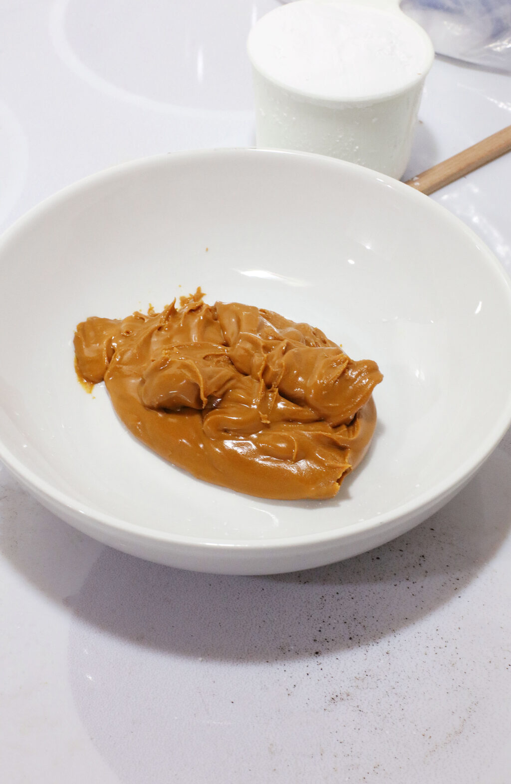 peanut butter in large white mixing bowl