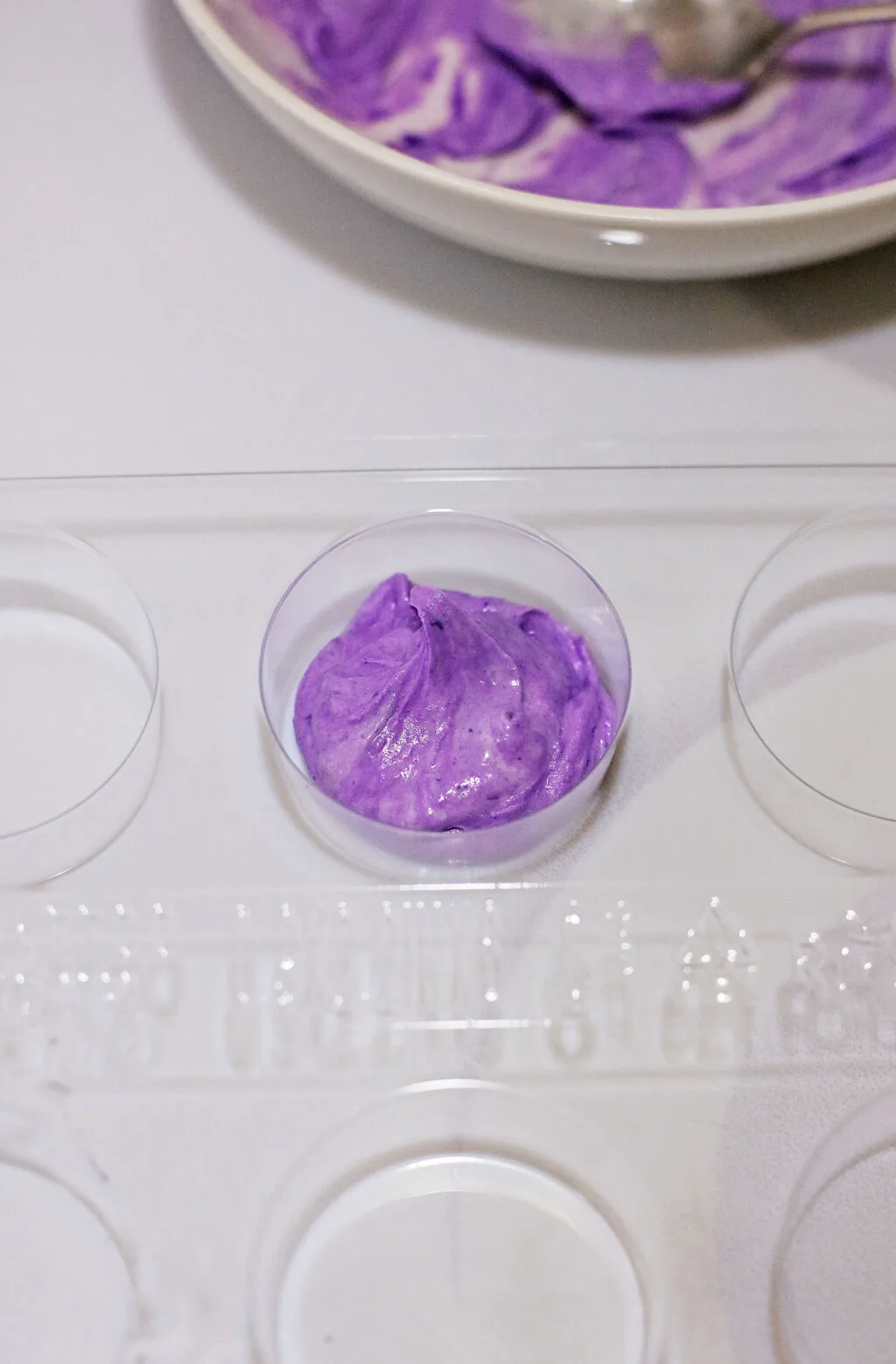 cookie mold filled with purple chocolate