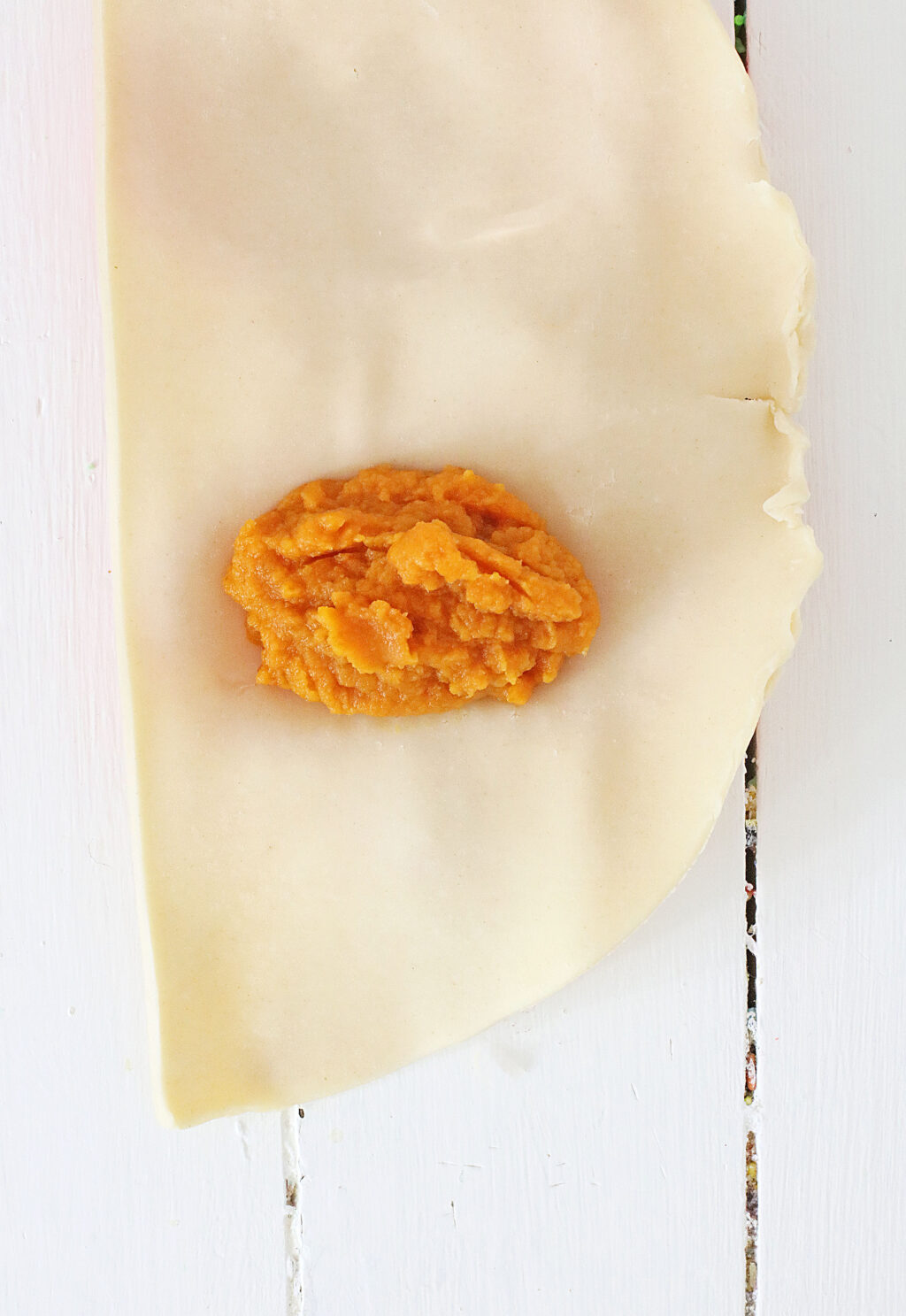 pumpkin puree inside pie dough
