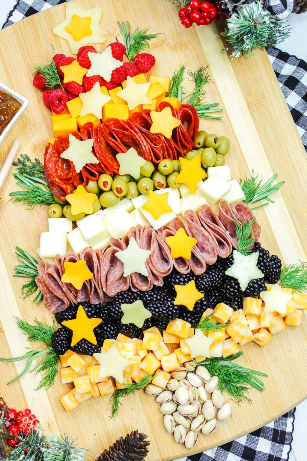 charcuterie board in the shape of a christmas tree for christmas