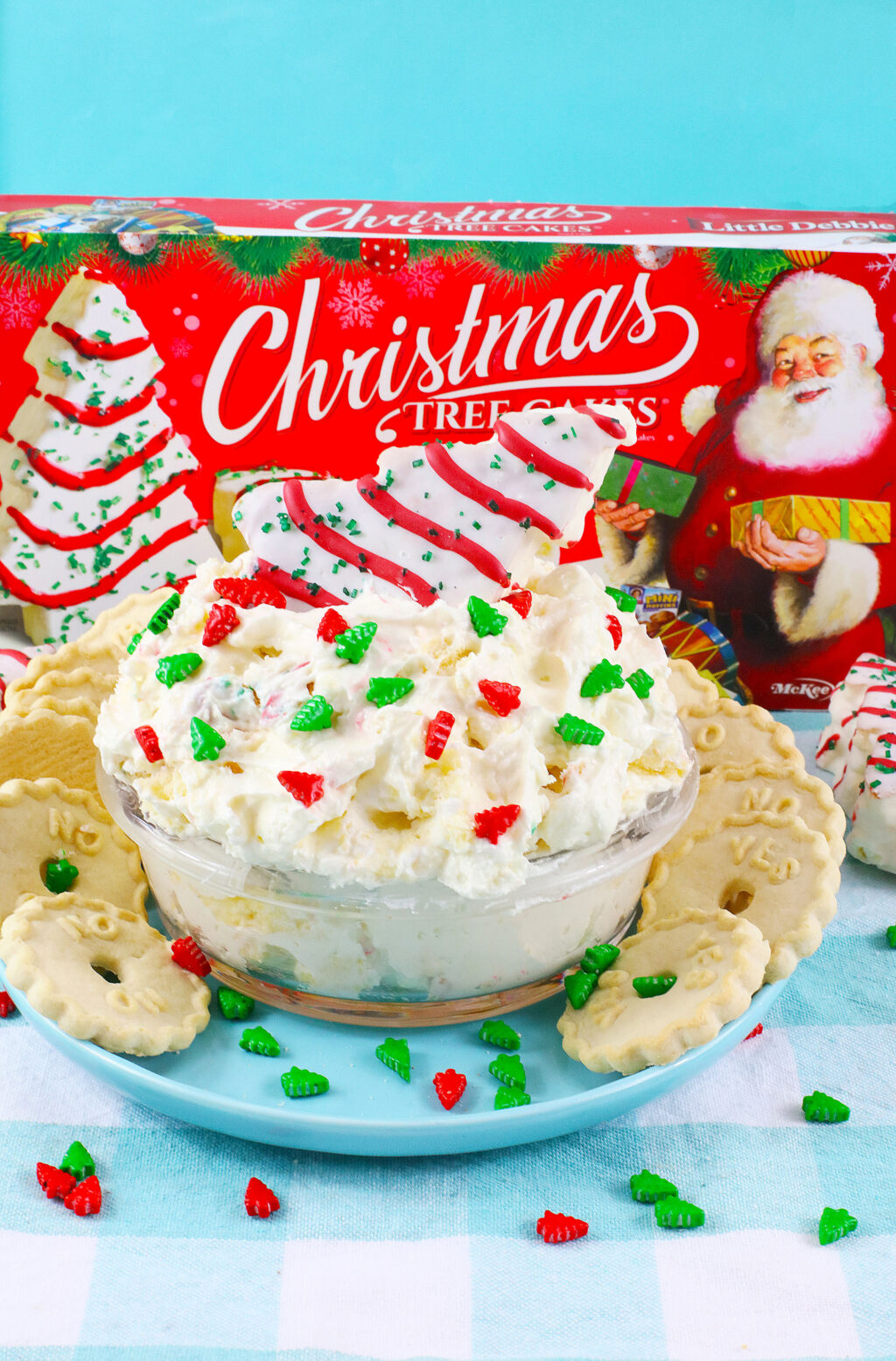 little debbie christmas tree dip in a clear bowl with cookies beside it