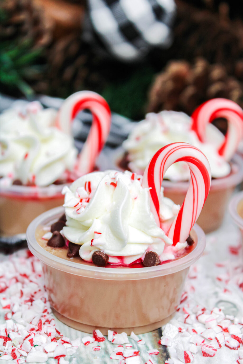 peppermint hot cocoa jello shots on table with christmas decor