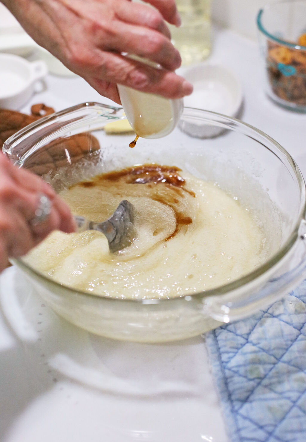 pouring vanilla into mixture