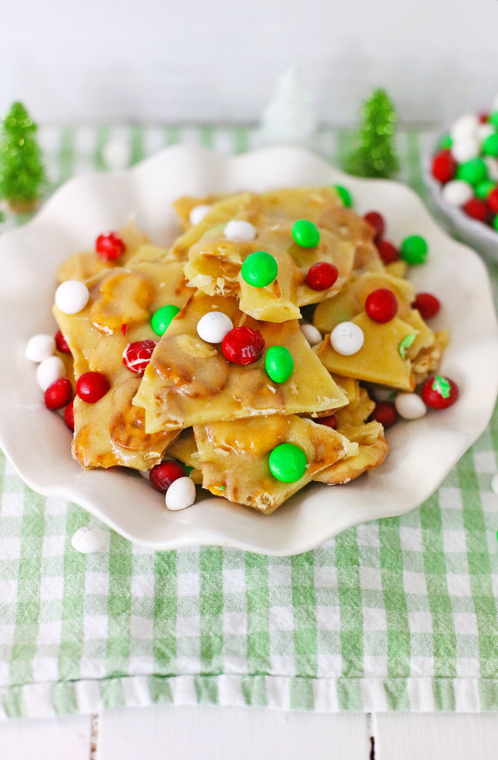 pieces of nut free christmas brittle on white plate