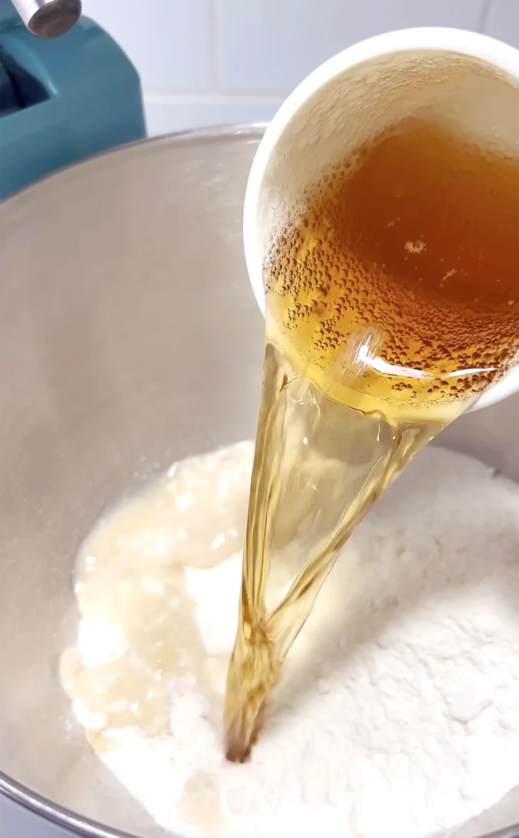 cream soda being poured into bowl with cake mix