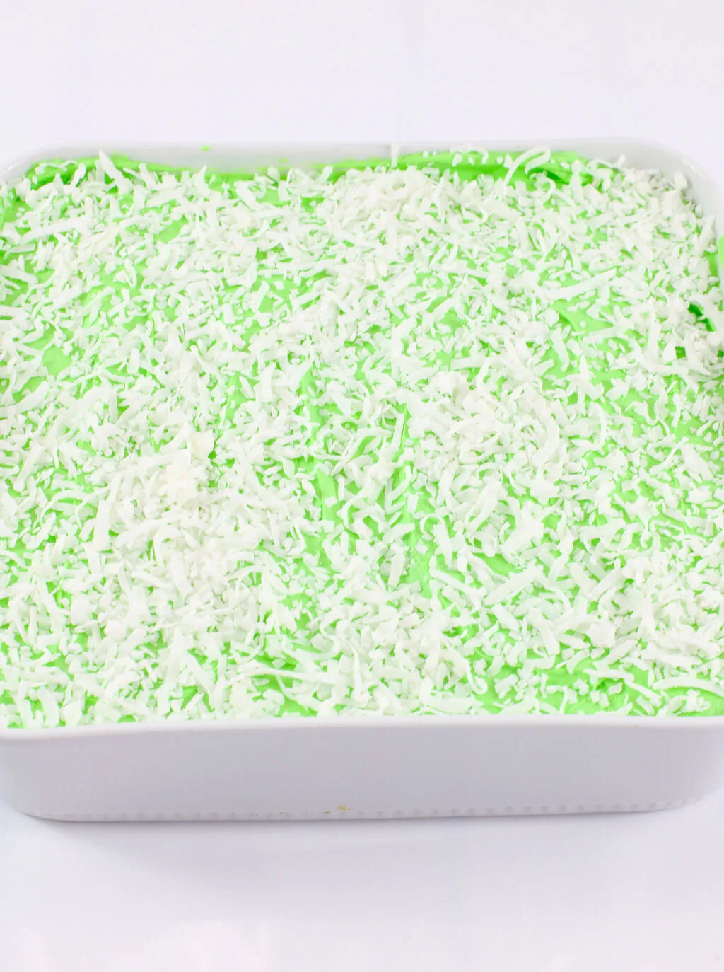 shredded coconut on top of mountain dew cake