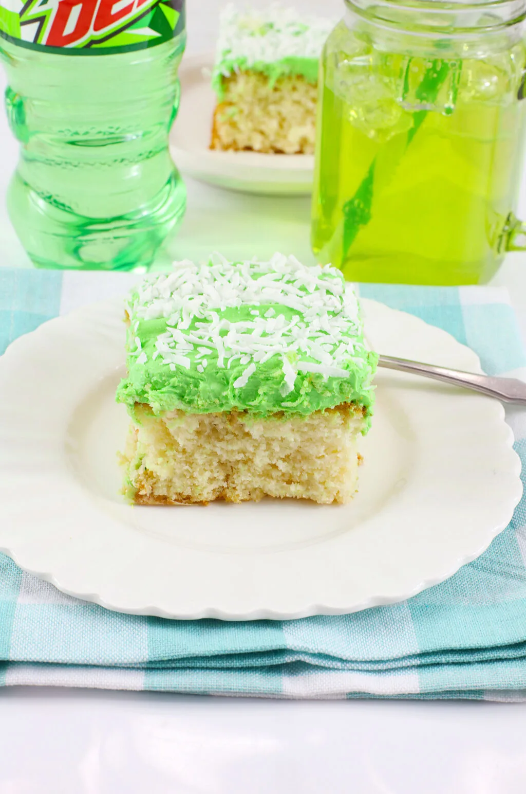 slice of mountain dew cake on white plate