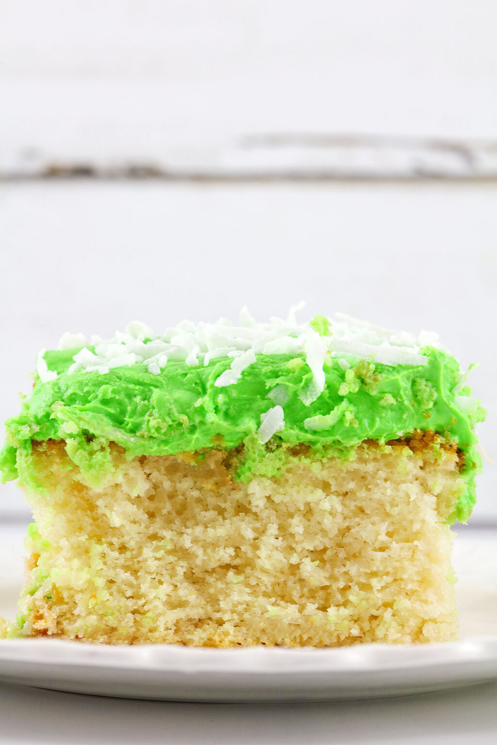 up close view of a slice of mountain dew cake on a plate