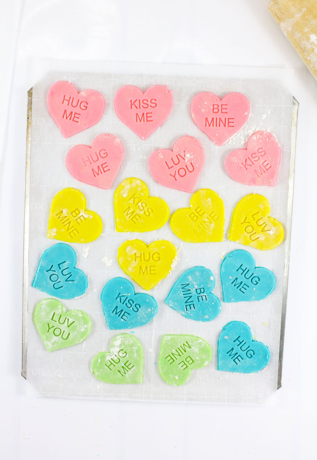 conversation heart cookies on cookie sheet