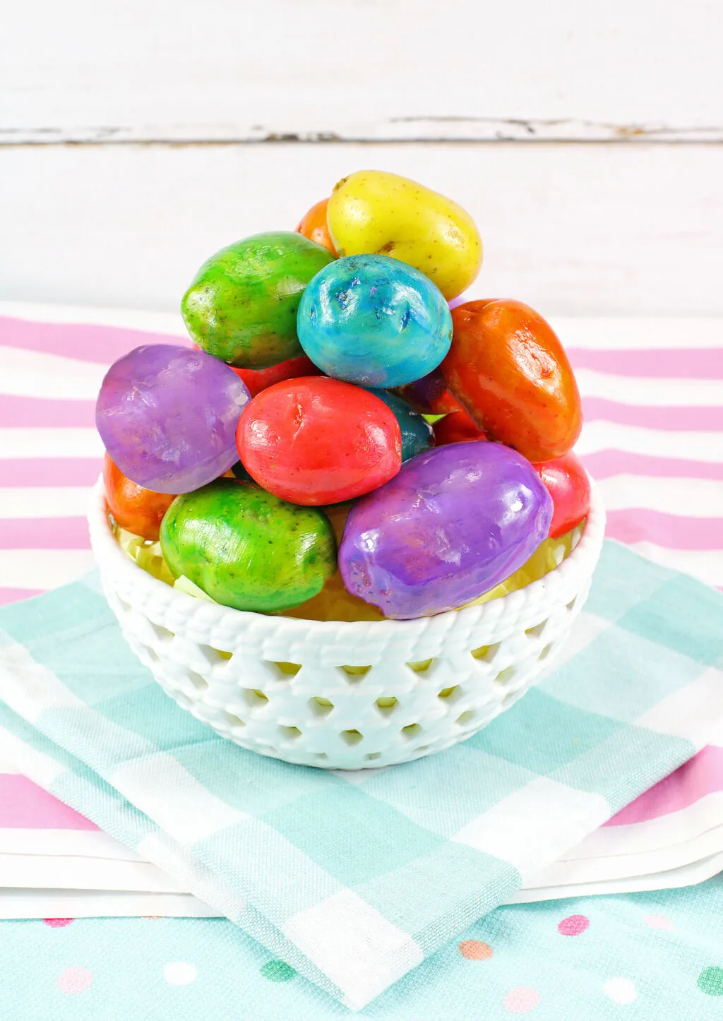 white bowl filled with easter egg dyed potatoes