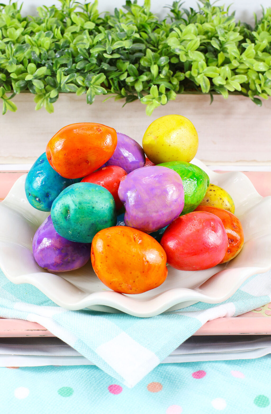 white plate of easter egg dyed potatoes