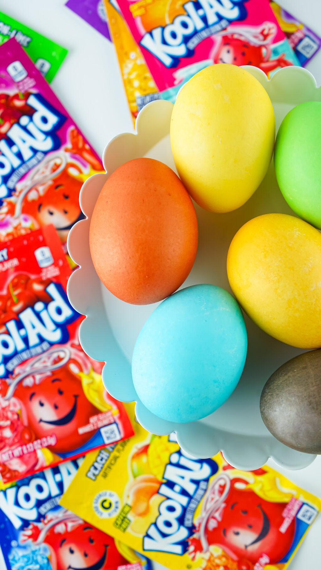 colorful kool-aid dyed easter eggs on white easter tray